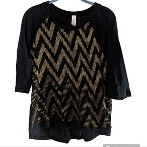 Black sweater with gold chevron design